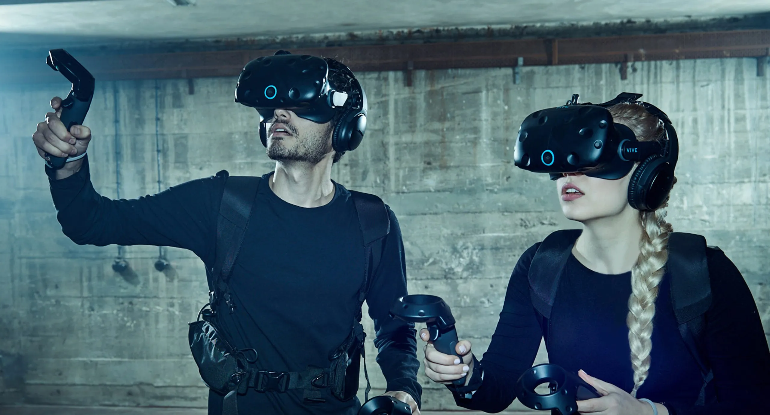 Two players wearing VR headsets and controllers